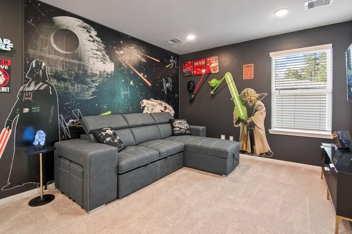 Star Wars game room with a Death Star mural